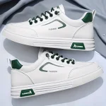 თეთრი სპორტული ბოტასები მწვანე დეტალებით